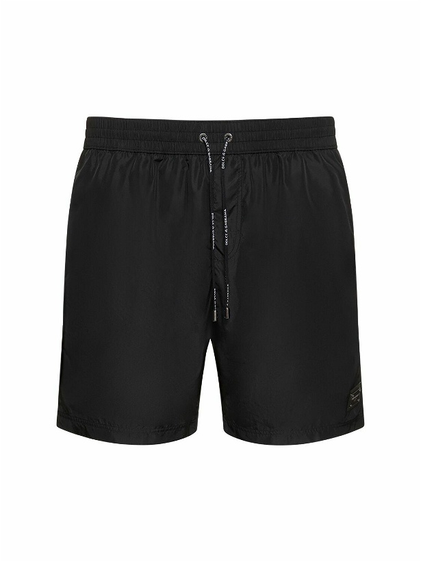 Photo: DOLCE & GABBANA Solid Color Swim Shorts with Logo Plaque