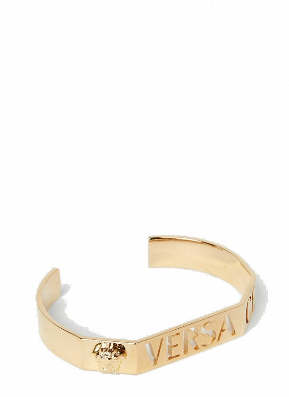 Photo: Versace - Cut-Out Logo Bracelet in Gold