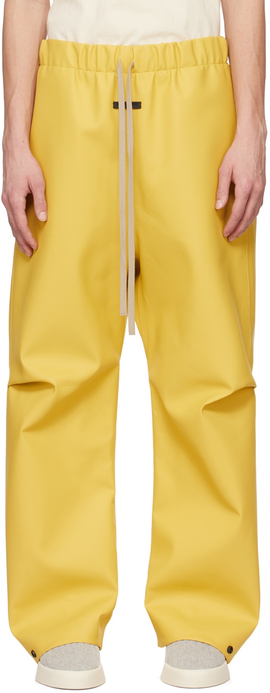 Photo: Fear of God Yellow Rubberized Trousers