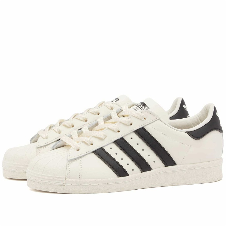 Photo: Adidas Superstar 82 OG Sneakers in Cloud White/Core Black/Off White