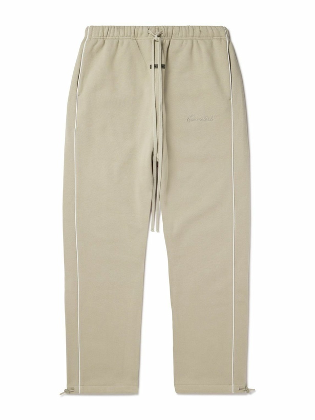 Photo: FEAR OF GOD ESSENTIALS - Tapered Logo-Appliquéd Cotton-Blend Jersey Sweatpants - Neutrals