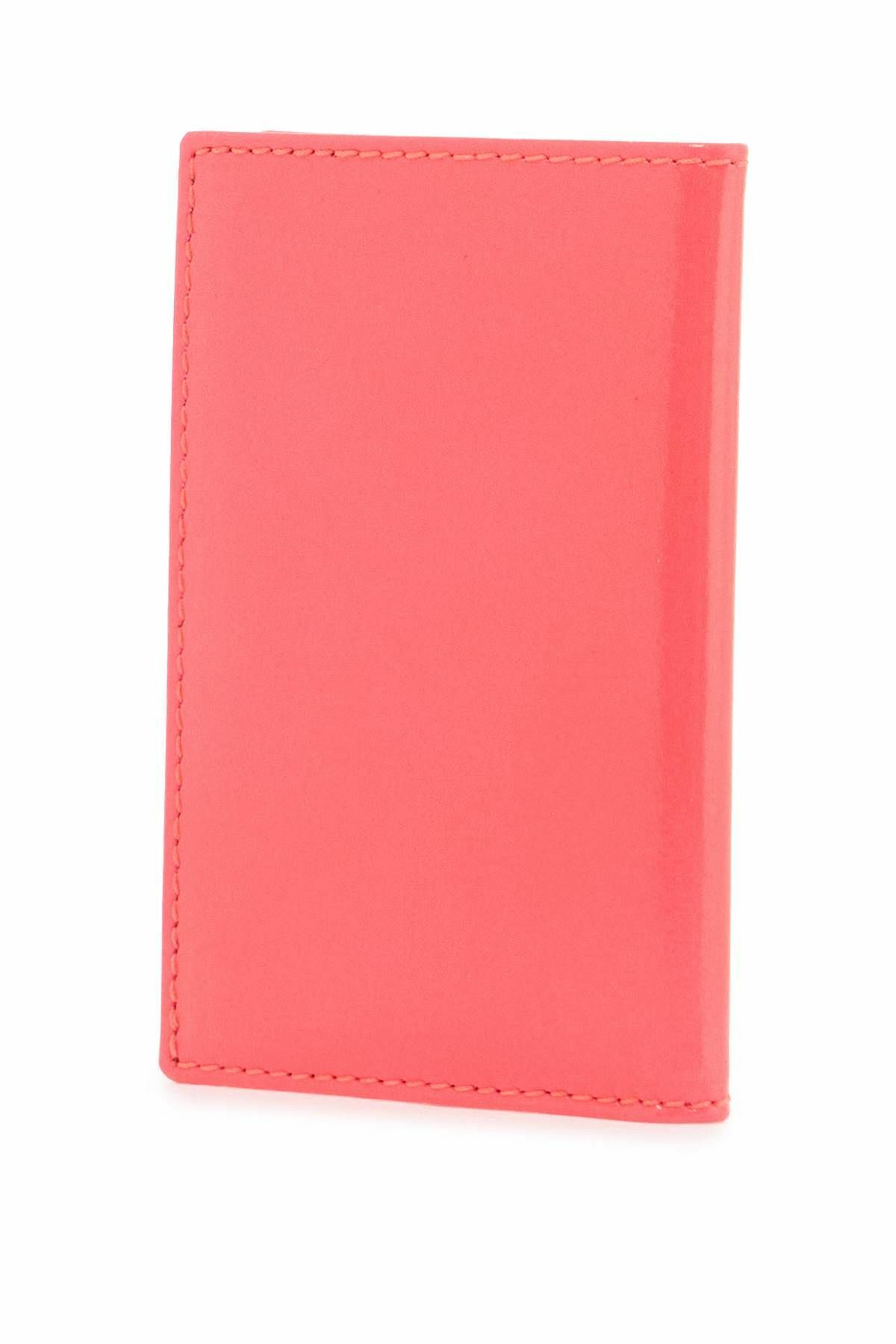 COMME DES GARCONS WALLET portafoglio compatto unisex rosa fluo in pelle di capra Pink