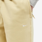 Nike Men's Solo Swoosh Fleece Pant in Team Gold/White
