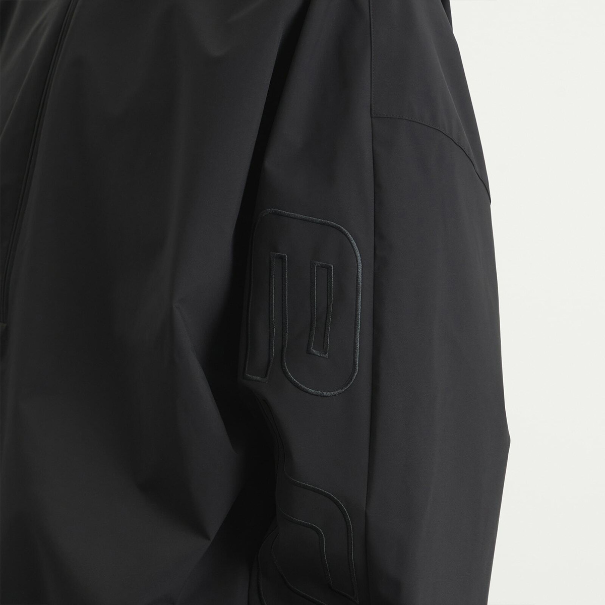 Fear of God ESSENTIALS Men's Active Trace 1/2 Zip Track Jacket in Vintage Black