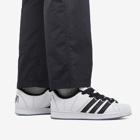 Adidas Men's x KORN SUPERMODIFIED Sneakers in White/Black/Pantone