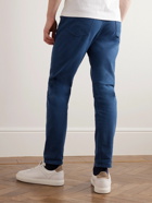 Brunello Cucinelli - Tapered Garment-Dyed Stretch-Cotton Trousers - Blue