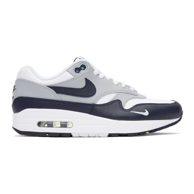 Photo: Nike White and Grey Air Max 1 LV8 Sneakers