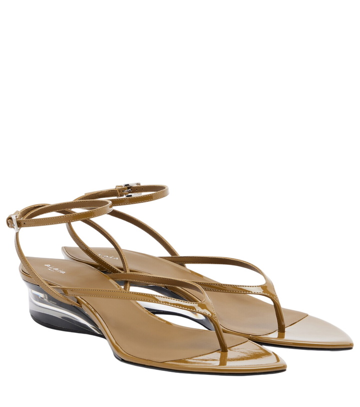 Photo: Alaïa Invisible patent leather wedge thong sandals