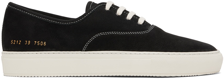 Photo: Common Projects Black Four Hole Sneakers
