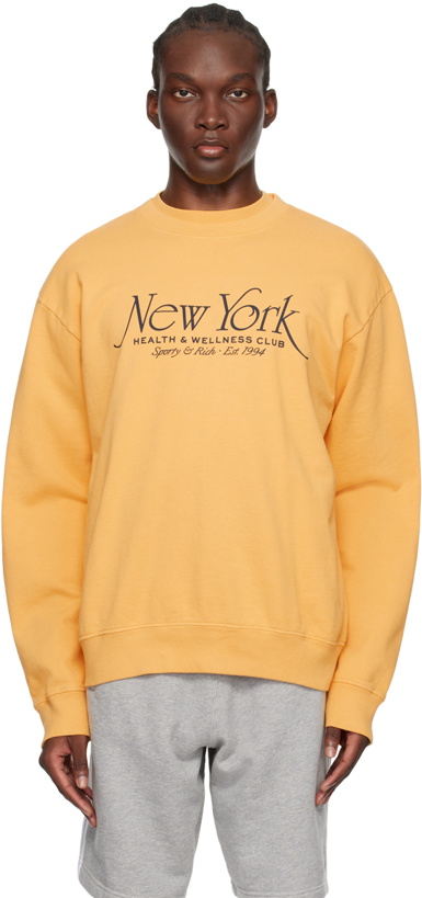 Photo: Sporty & Rich Yellow 'NY Health & Wellness Club' Sweatshirt