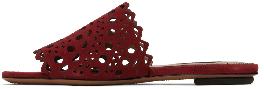 ALAIA VIENNE FLAT MULES IN GOLDEN LAMBSKIN