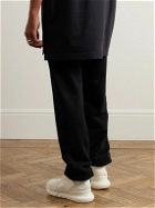 AMIRI - Tapered Printed Cotton-Jersey Sweatpants - Black