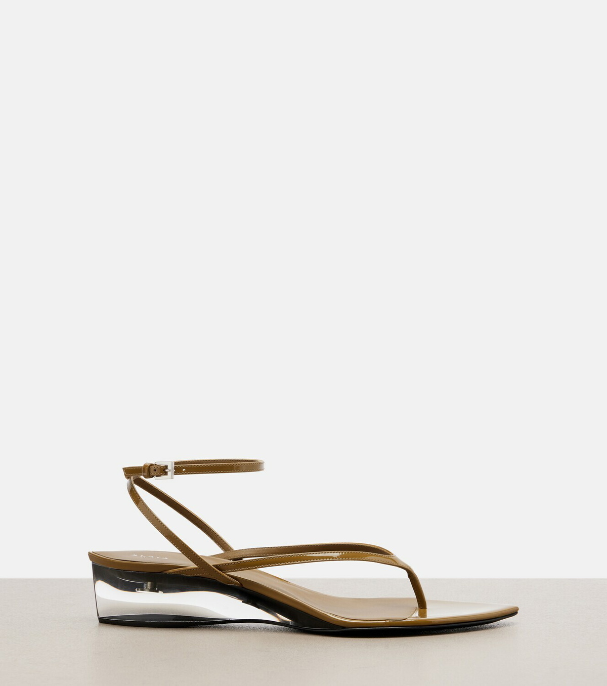 Alaïa Invisible patent leather wedge thong sandals