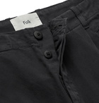 Folk - Black Assembly Tapered Pleated Cotton-Canvas Trousers - Black