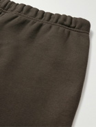 FEAR OF GOD ESSENTIALS - Tapered Logo-Appliquéd Cotton-Blend Jersey Sweatpants - Black