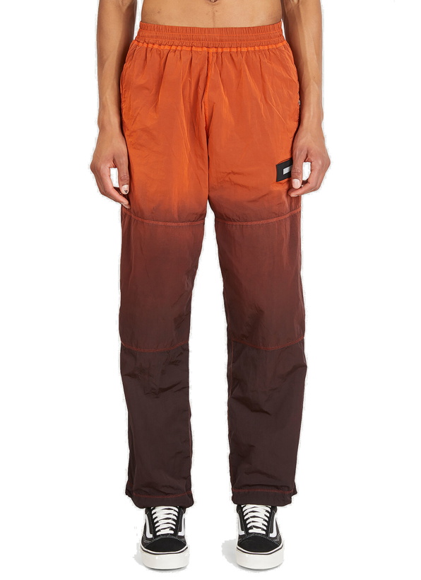 Photo: Spray-Dyed Windcheater Pants in Orange