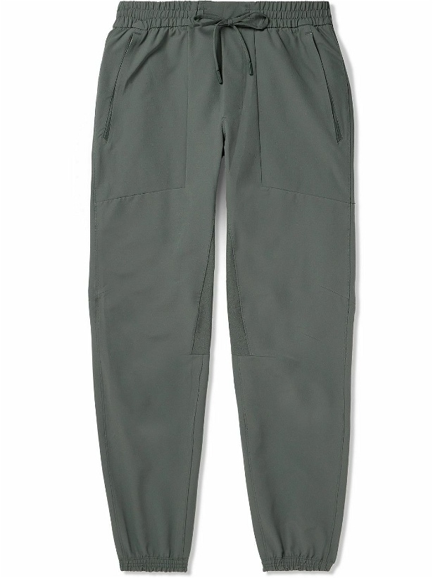 Photo: Lululemon - License to Train Slim-Fit Tapered Stretch Recycled-Shell Track Pants - Green