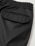 Brioni - Tapered Wool and Cashmere-Blend Flannel Drawstring Cargo Trousers - Black