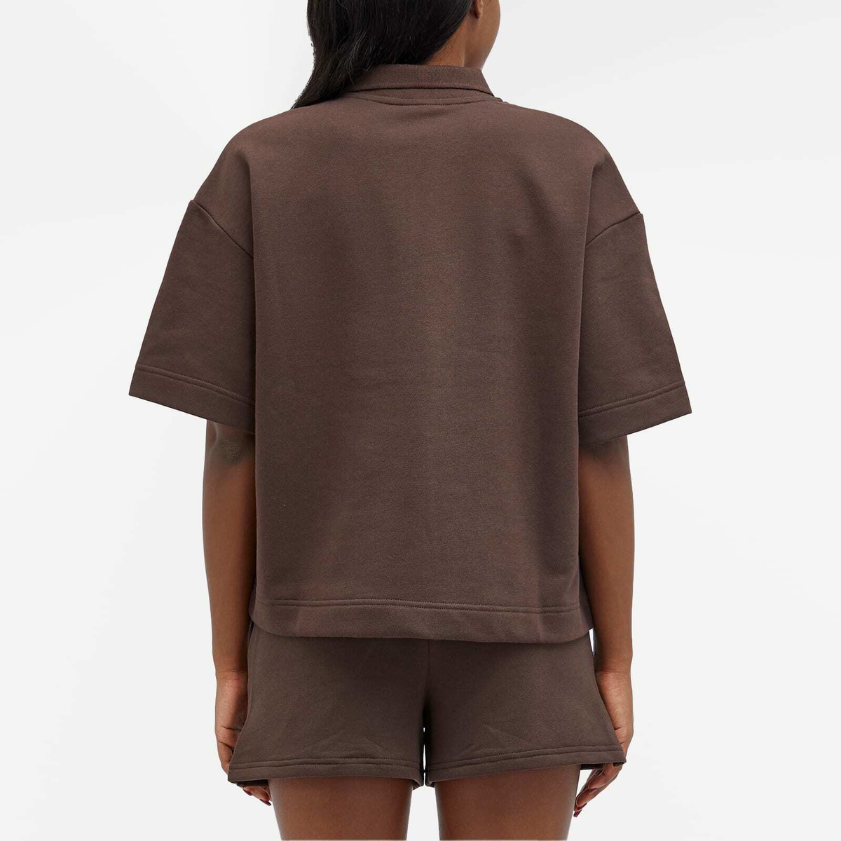 New Balance Women's Linear Heritage French Terry Collared Shirt in Black Coffee