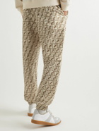 Fendi - Tapered Logo-Print Shell Drawstring Trousers - Neutrals