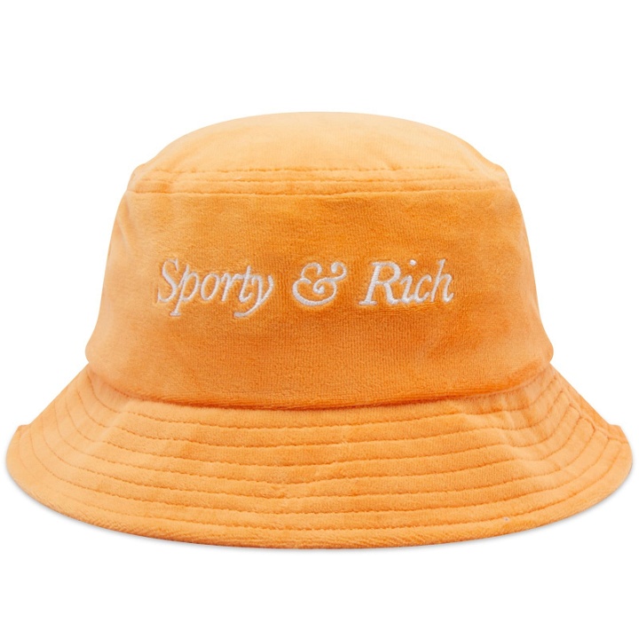 Photo: Sporty & Rich Italic Logo Velour Bucket Hat in Peach/White