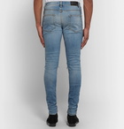 AMIRI - MX1 Skinny-Fit Panelled Distressed Stretch-Denim Jeans - Men - Mid denim