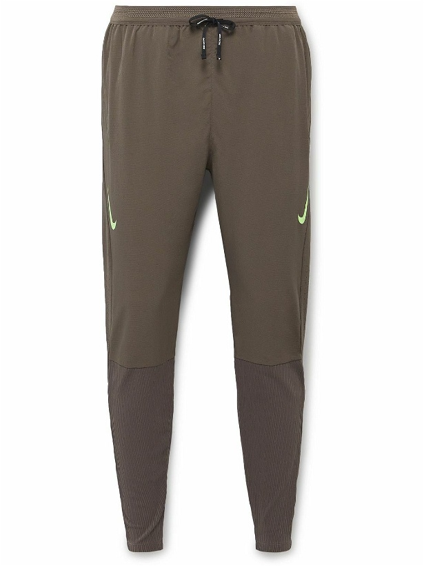 Photo: Nike Running - AeroSwift Slim-Fit Tapered Dri-FIT ADV Track Pants - Green