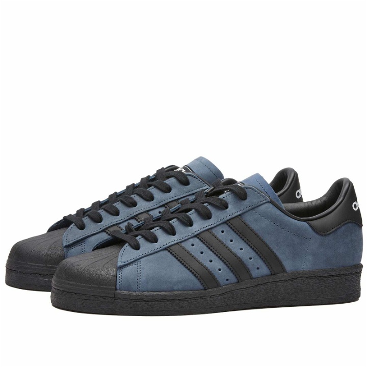 Photo: Adidas Men's SUPERSTAR 82 Sneakers in Altered Blue/Core Black/White