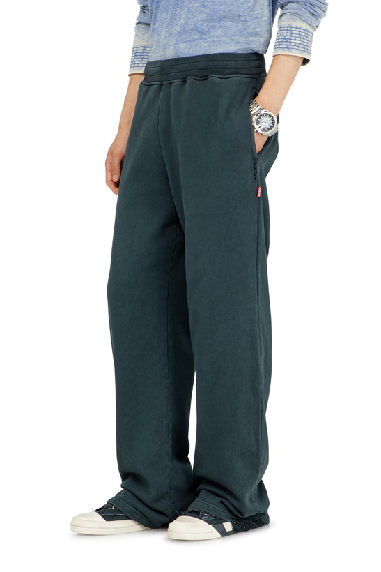 Photo: Diesel Distressed sweatpants with crystal details - Pants Mens in Blue