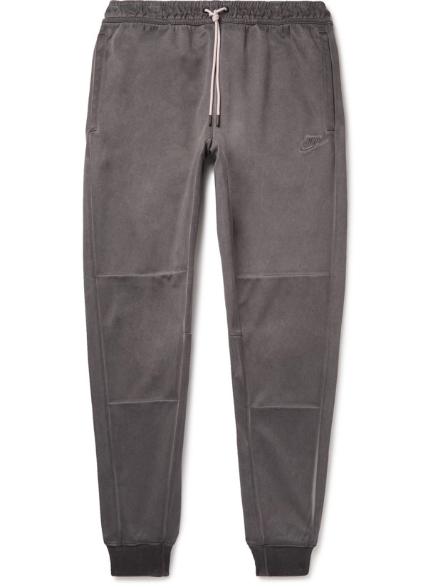 Photo: NIKE - Tapered Logo-Embroidered Panelled Recycled Jersey Sweatpants - Gray