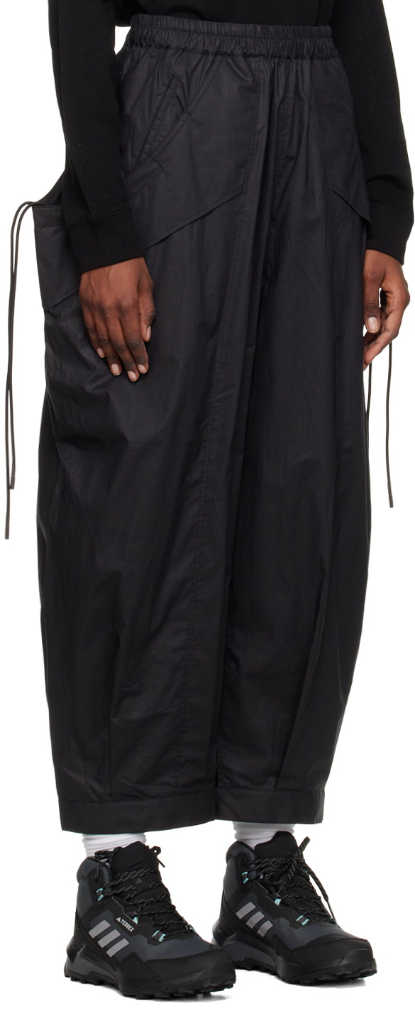 Black stretch cuffed wide-leg trousers | Genny