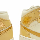 Air Jordan Women's 1 Mid SE Sneakers in Pale Vanilla/Metallic Gold