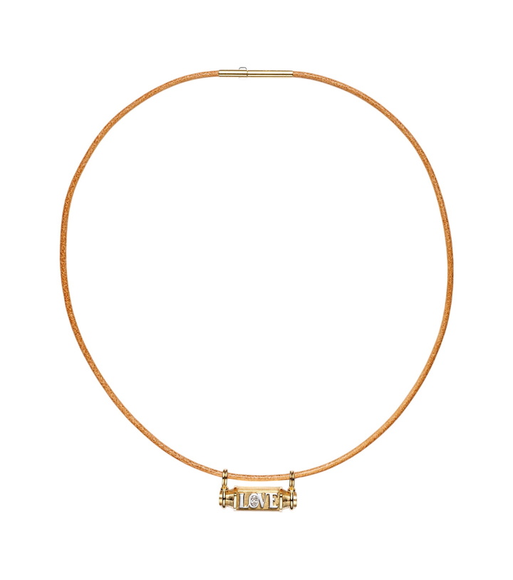 Photo: Marie Lichtenberg Love Smash 18kt gold and leather pendant necklace with diamond