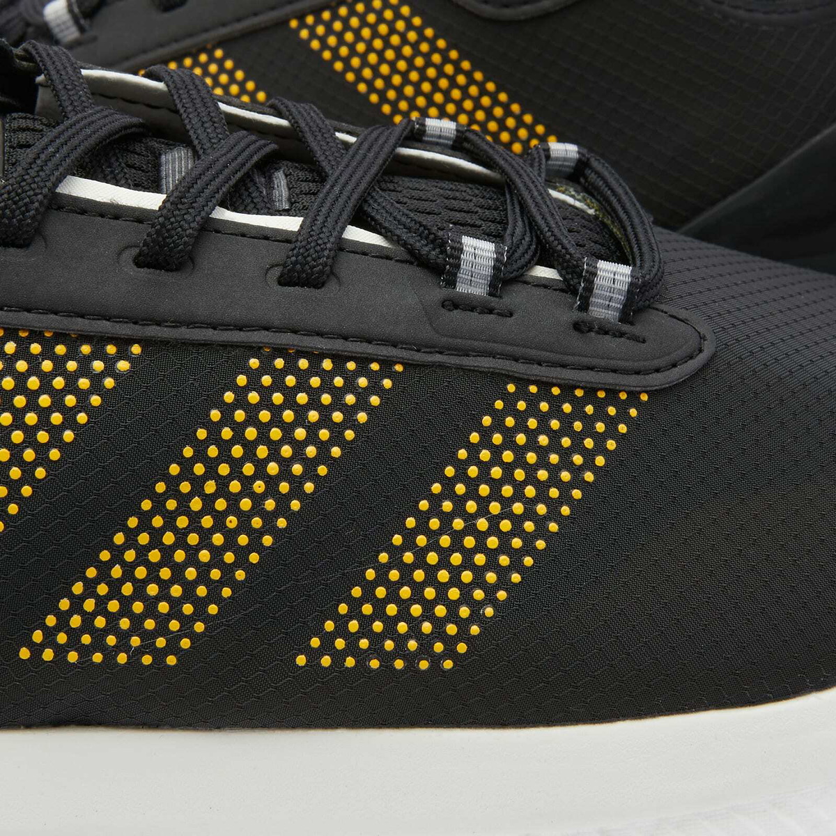 Adidas Men's Avryn Sneakers in Core Black/Solar Gold adidas
