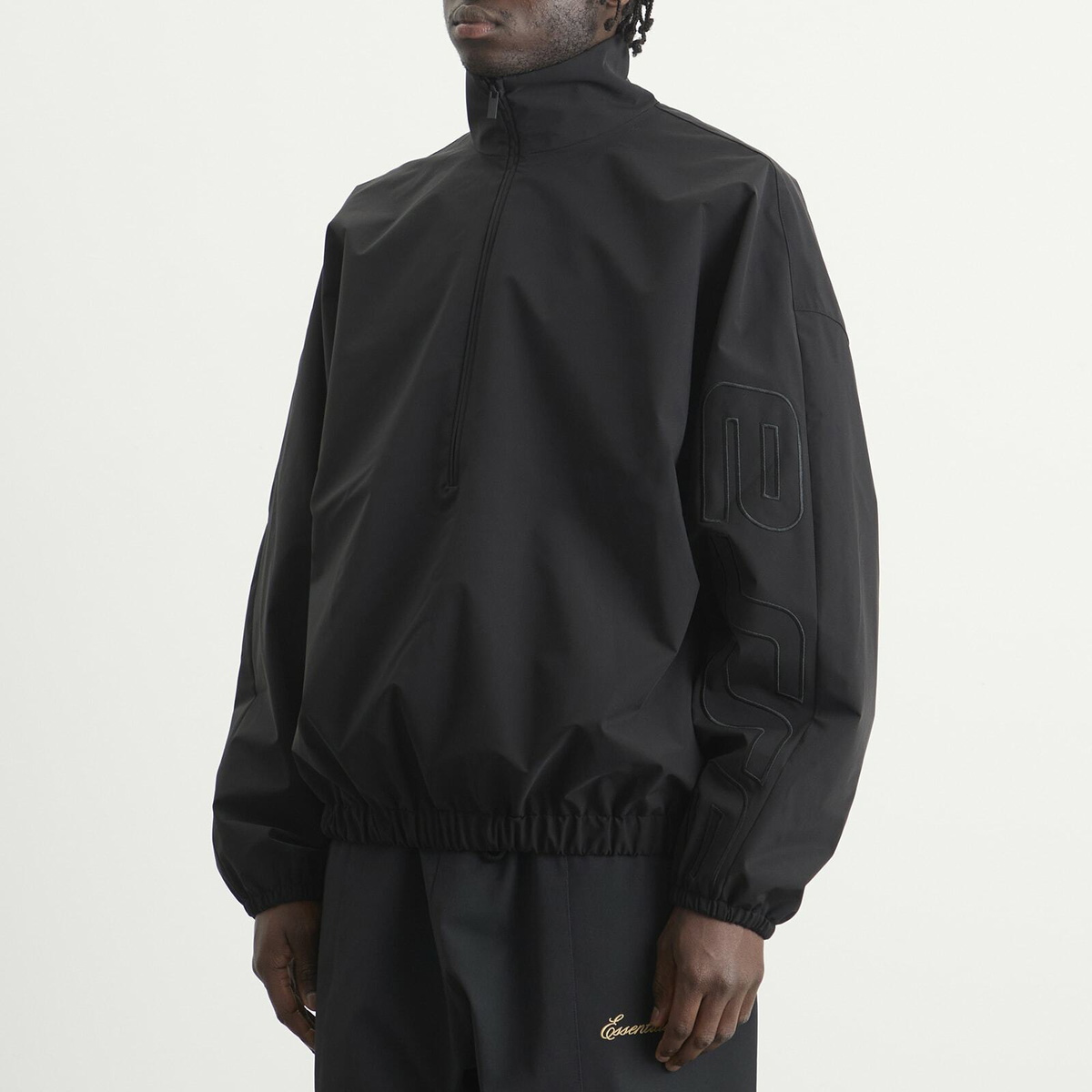 Fear of God ESSENTIALS Men's Active Trace 1/2 Zip Track Jacket in Vintage Black
