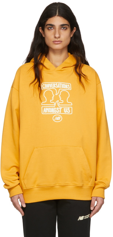 Photo: New Balance Yellow 'Conversations Amongst Us' Hoodie