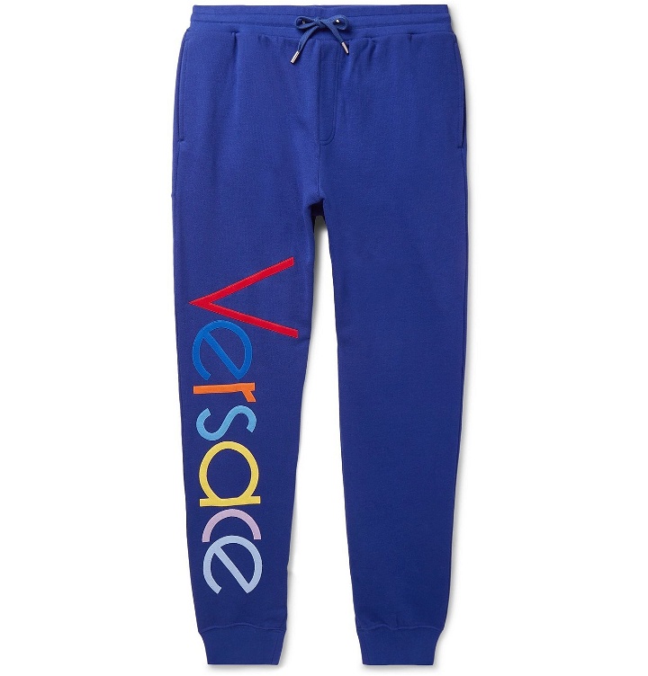Photo: Versace - Tapered Logo-Embroidered Fleece-Back Cotton-Jersey Sweatpants - Blue