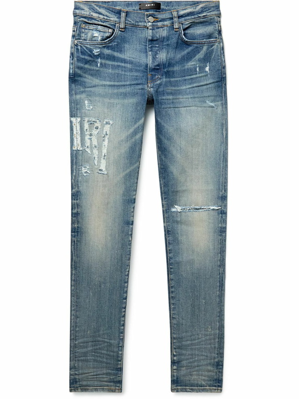 Photo: AMIRI - Skinny-Fit Distressed Jeans - Blue