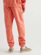 FEAR OF GOD ESSENTIALS - Tapered Logo-Appliquéd Cotton-Blend Jersey Sweatpants - Orange
