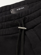 AMIRI - Tapered Logo-Embroidered Cotton-Jersey Sweatpants - Black