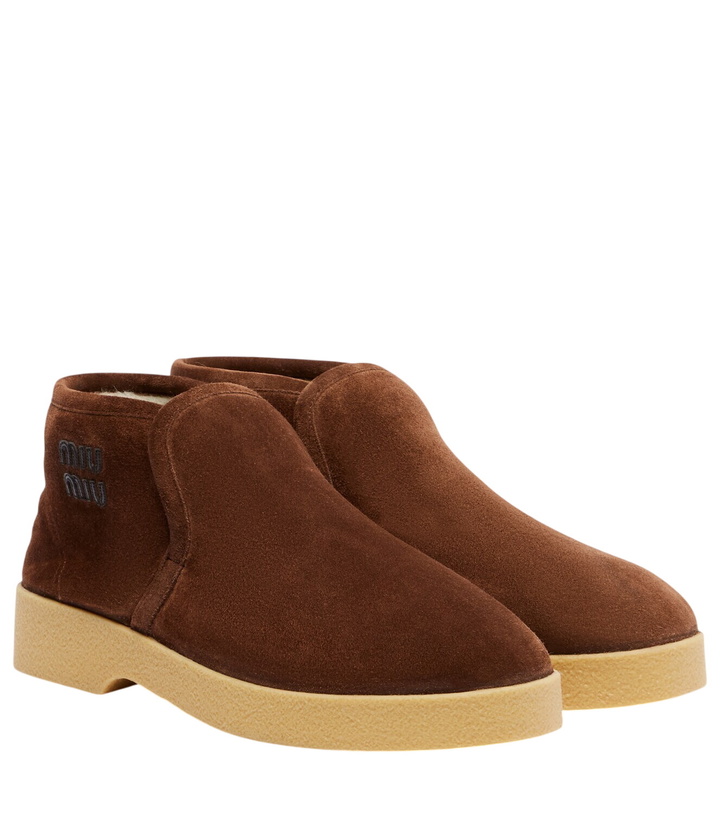 Photo: Miu Miu Logo shearling-lined suede ankle boots