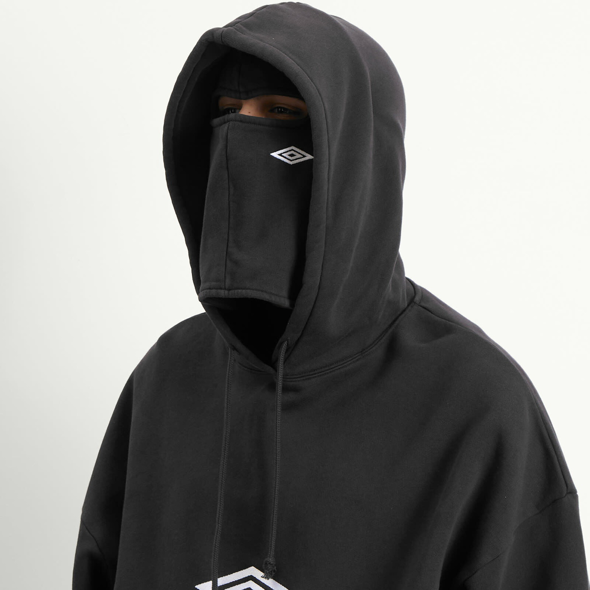 Umbro by Slam Jam Men's OG Logo Mask Hoodie in Washed Black