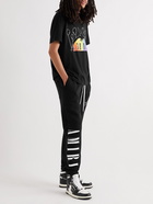 AMIRI - Slim-Fit Tapered Logo-Print Cotton-Jersey Sweatpants - Black