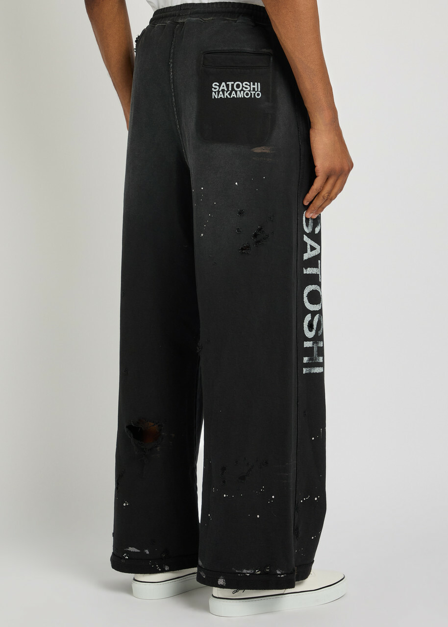 Satoshi Nakamoto Luke Printed Distressed Wide-leg Cotton Sweatpants Black
