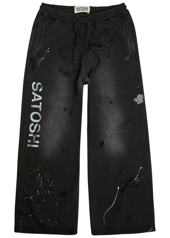 Photo: Satoshi Nakamoto Luke Printed Distressed Wide-leg Cotton Sweatpants Black