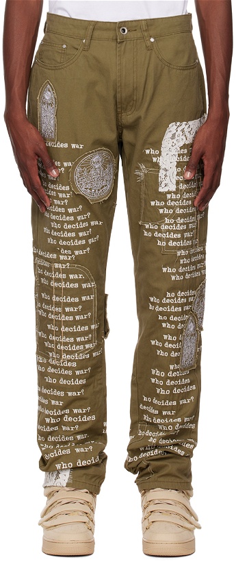 Photo: Who Decides War by MRDR BRVDO Khaki Fatigue Scripture Jeans