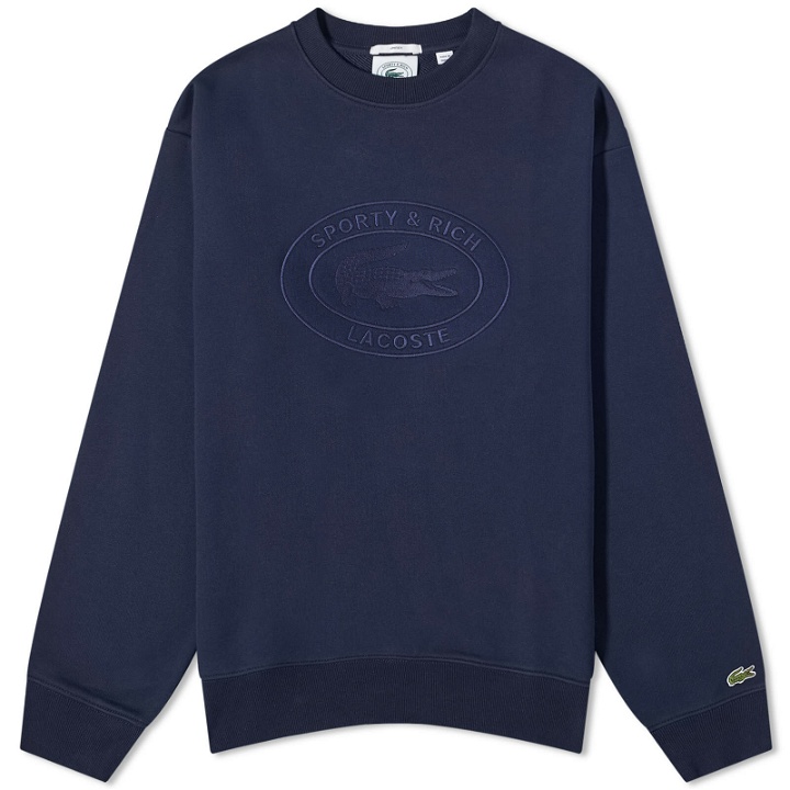 Photo: Sporty & Rich x Lacoste Oval Logo Embroidered Crew Sweat in Marine
