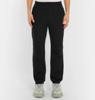 Balenciaga - Tapered Logo-Print Fleece-Back Cotton-Jersey Sweatpants - Men - Black