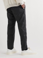 Fear of God - Tapered Logo-Appliquéd Rubber-Bonded Nylon Sweatpants - Black