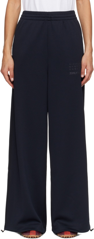 Photo: MM6 Maison Margiela Black Salomon Edition Mesh Sweatpants